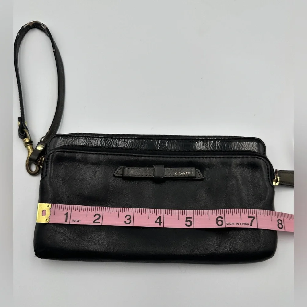 Coach Black Leather Wristlet Wallet With Patent Leather Accent And Bow Detail